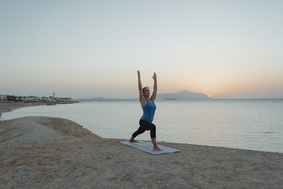 Yoga practitioner finding balance at sunrise